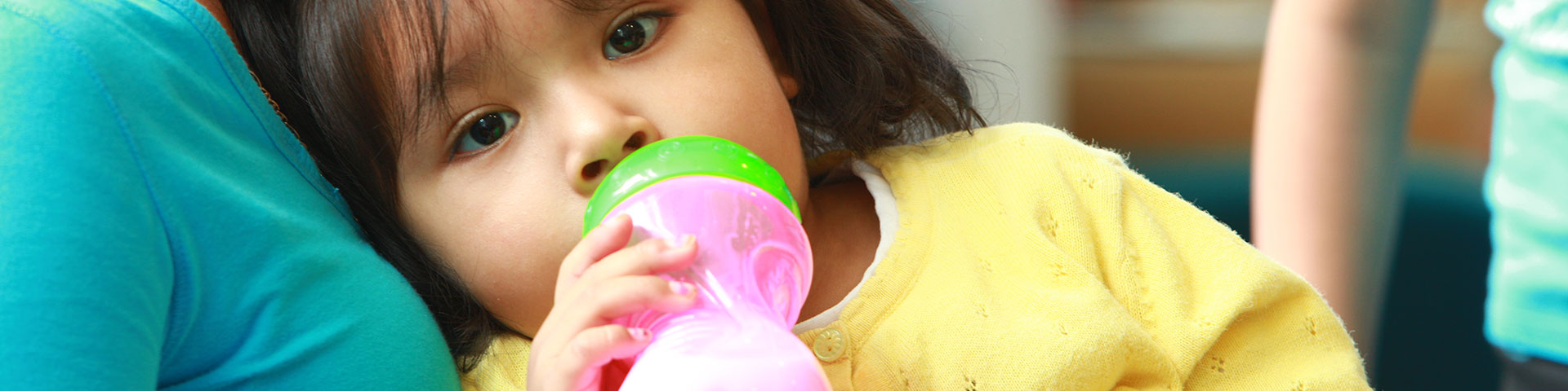 Child holding a bottle