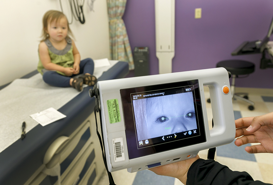 A simple device can take a picture of a child's eyes to find vision problems.