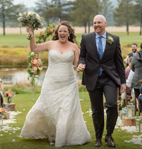 Matt McCallum and Gabi walking down the aisle at their wedding