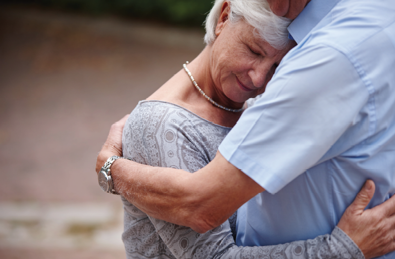 older woman hugs man