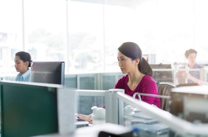 woman sitting at computer desk