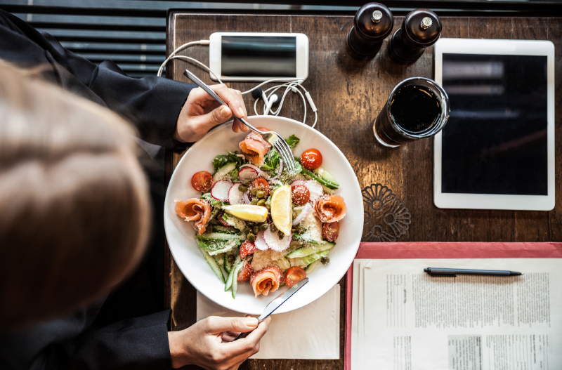 Overhead view of salad on wood table
