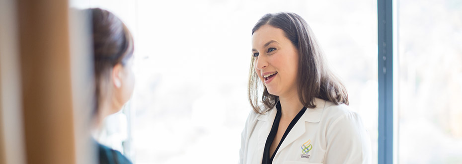 Dr. Elizabeth Shih, OHSU Family Medicine care provider, speaks with a patient