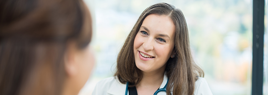 Dr. Elizabeth Shih of OHSU's Center for Women's Health speaking with a female patient.