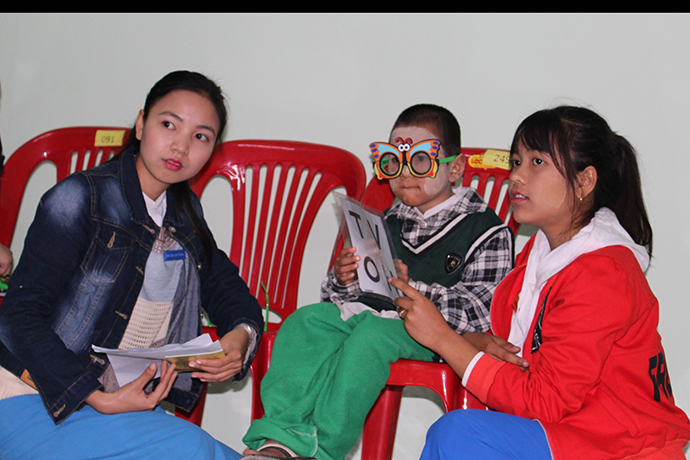 Nurse Aides from Tipitaka Hospital in Myanmar give pediatric eye screenings