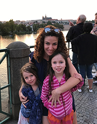 Dr. Megan Aylor posing with her two daughters.