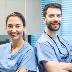 Mohs surgeons Anna Bar and Justin Leitenberger stand together