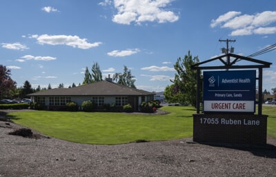Front of building and sign for Adventist Sandy Clinic
