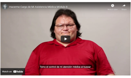 a dark haired man in a red polo shirt looks sad 