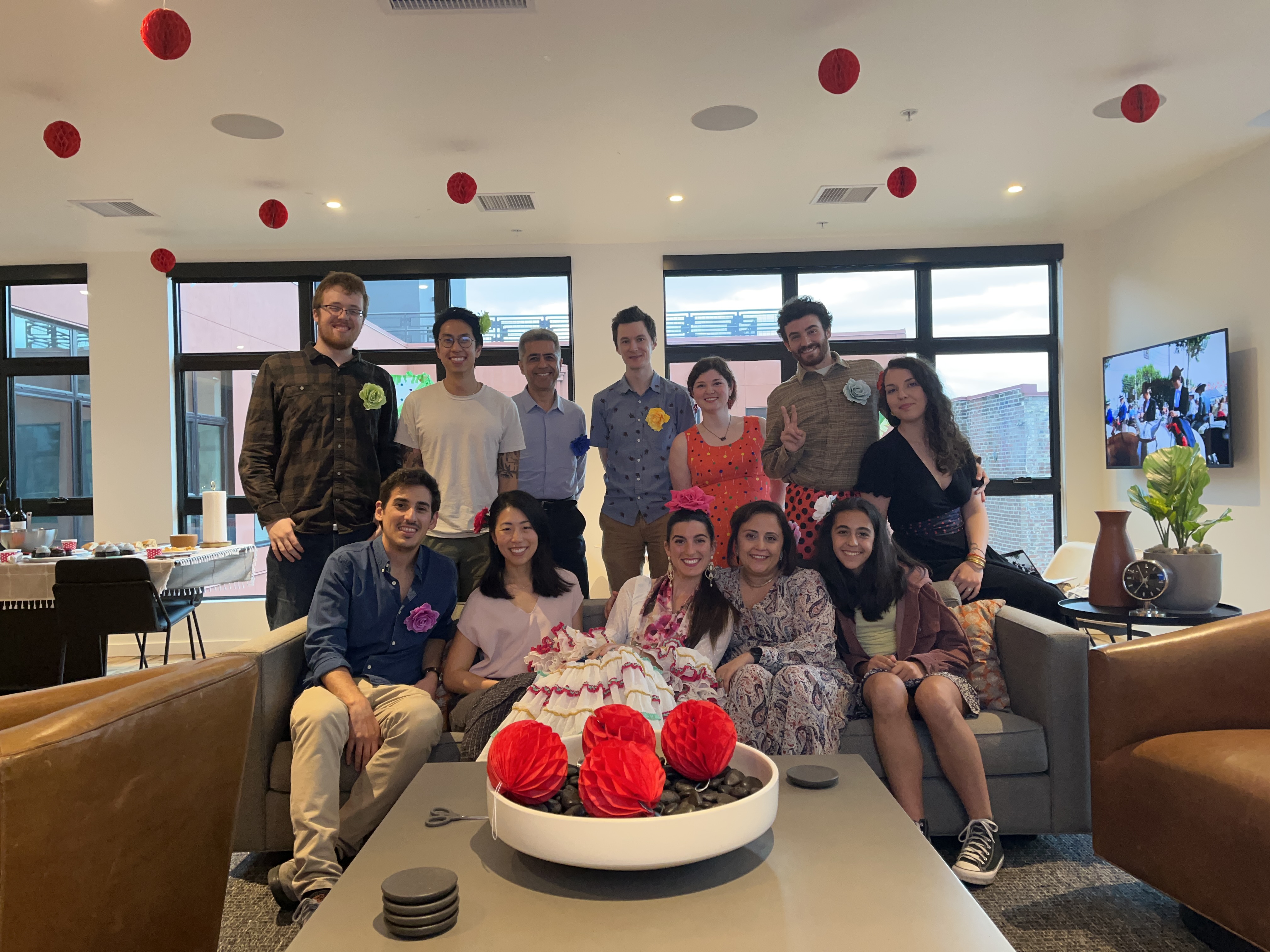 Ajami Lab members seated together on a couch
