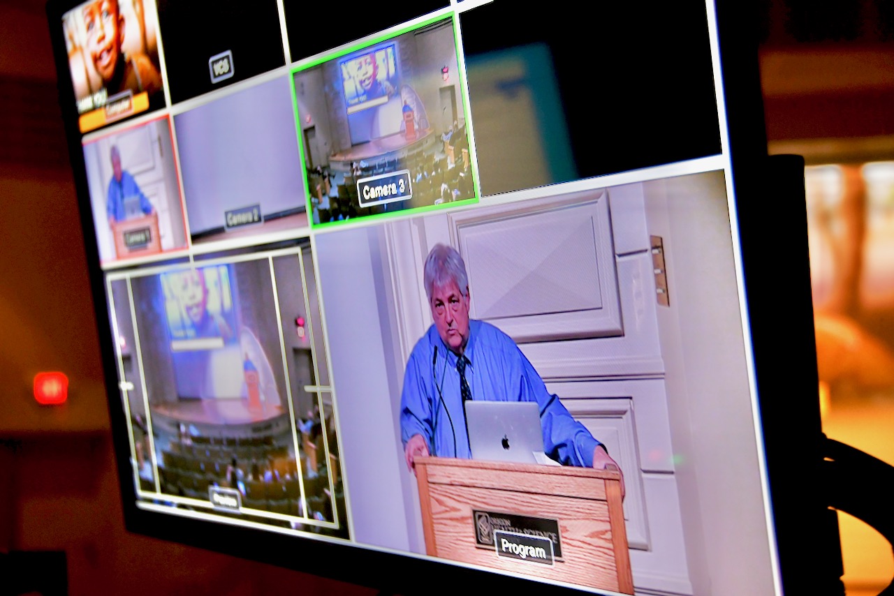 Still from video board of symposium keynote Mark Manary, April 13, 2022.