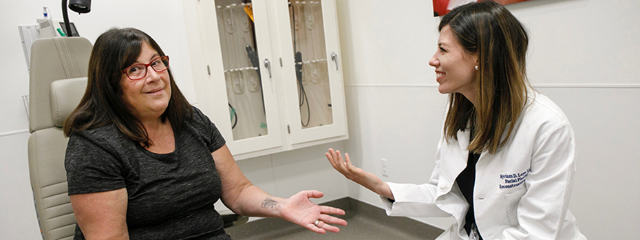 Dr. Myriam Loyo Li meets with Jarmila “Jarm” Hawes after facial reanimation surgery. Dr. Loyo Li, a facial plastic and reconstructive surgeon, oversees OHSU’s Facial Nerve Center, a key partner of the OHSU Nerve Center.