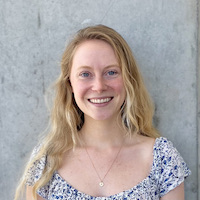 woman standing in front of wall