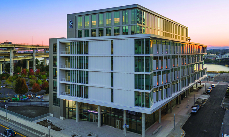 A photo of OHSU's Knight Cancer Research Building at sunset.