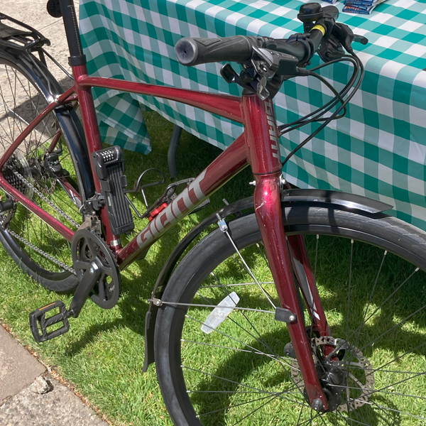 A red OHSU loaner bicycle