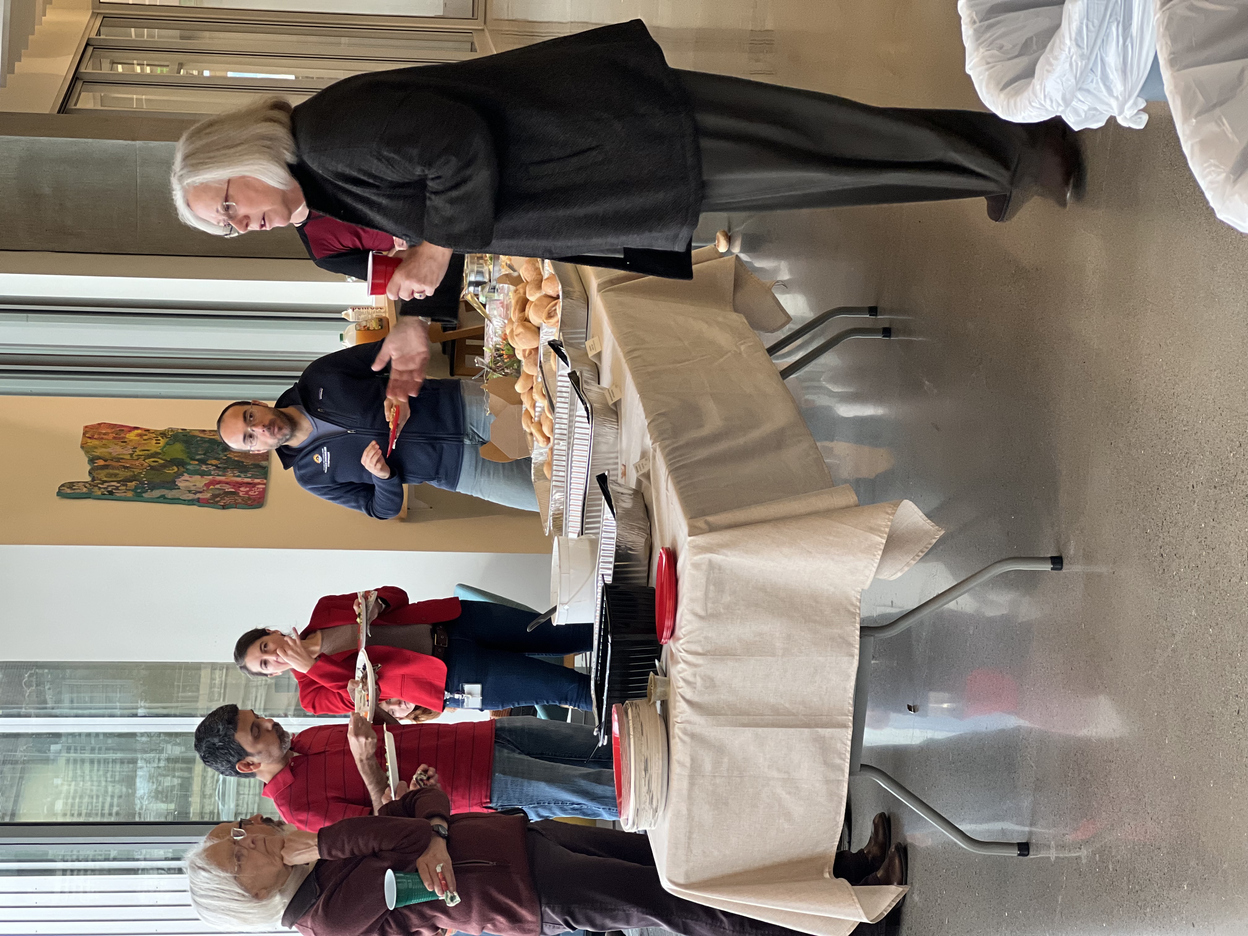 Lisa Coussens addressing CDCB department at holiday party 2023