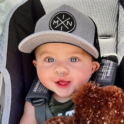 Seven-month-old Oliver in his car seat. He wears nose stents as he heals from cleft lip repair surgery.