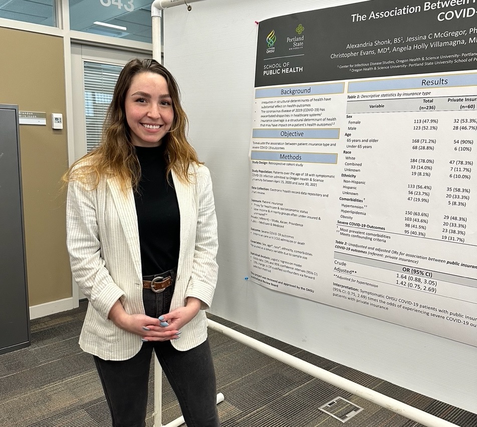 Trainee presenting research at conference.