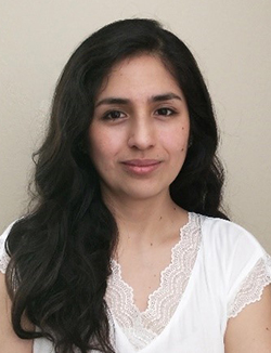 A professional headshot of Andrea Cuentas-Condori.