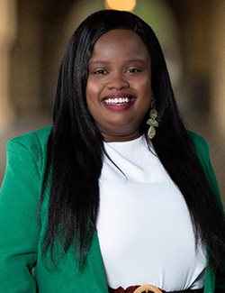A professional headshot of Monique Mendes.