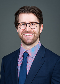 A professional headshot of Dr. Trevor Obrinsky.