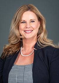 A professional headshot of Dr. Gerda Teglassy.