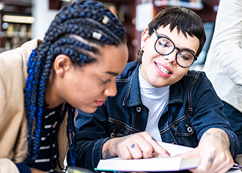 A student receives tutoring support.