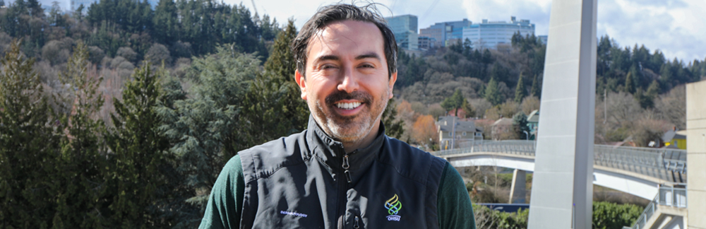 Alex Ortega smiles for a picture at OHSU