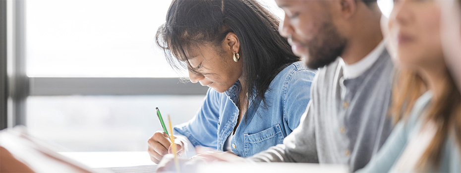 University students taking notes.