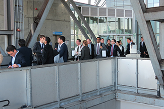 Nearly 20 residents and fellows in formal attire awaiting the OHSU Tram at the top of Marquam Hill.