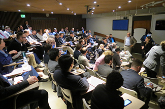 Residents and fellows in a lecture hall during class.