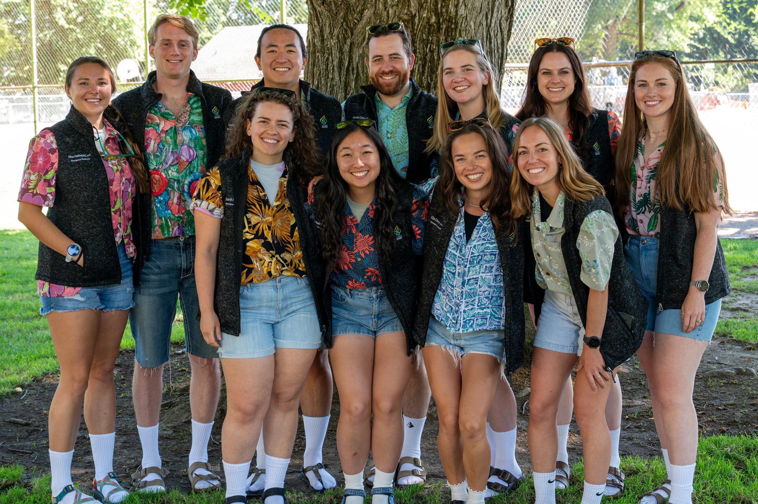 Group of resident physicians in floral shirts smiling