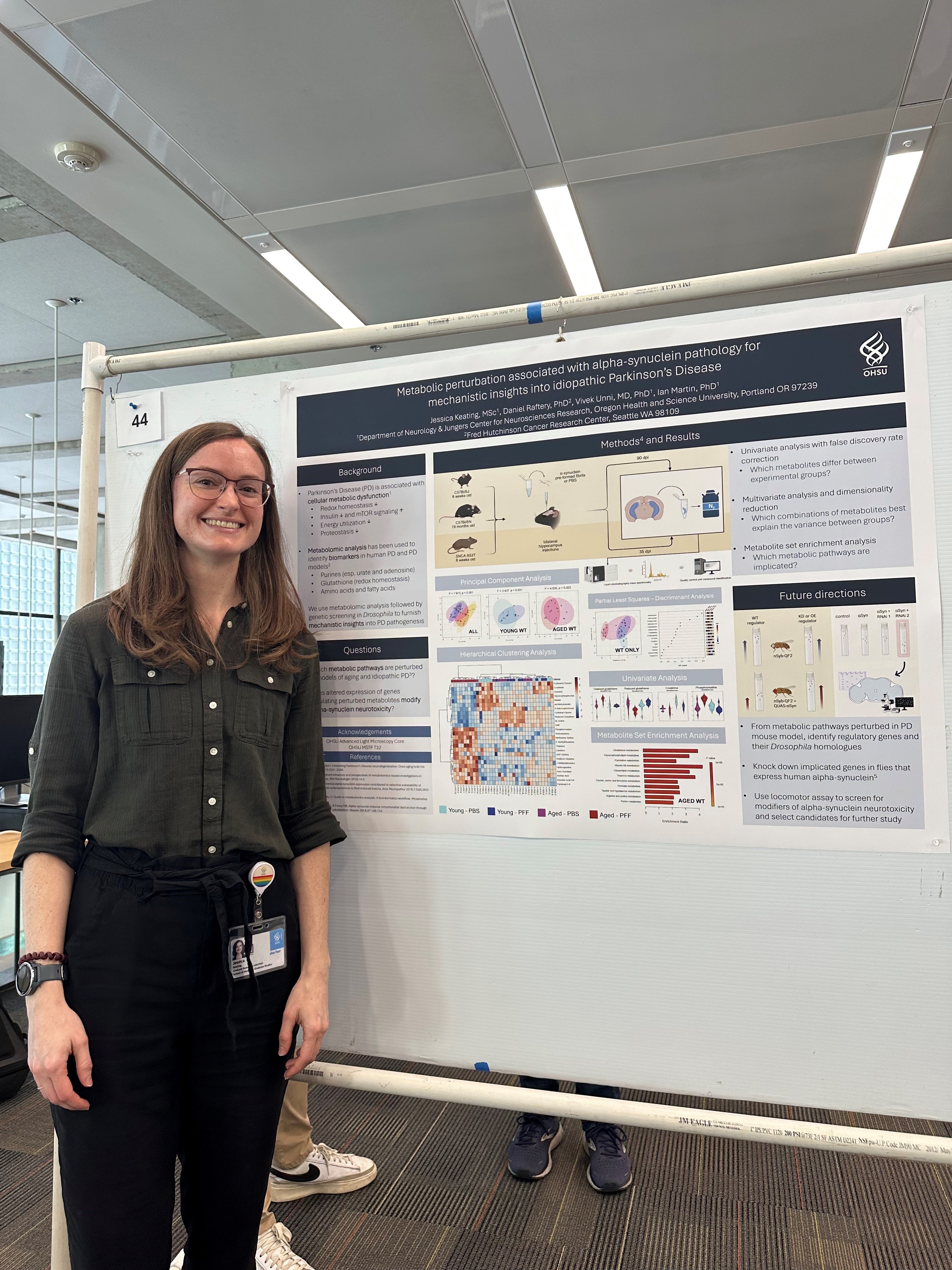 MD/PhD student is standing by pster presentation