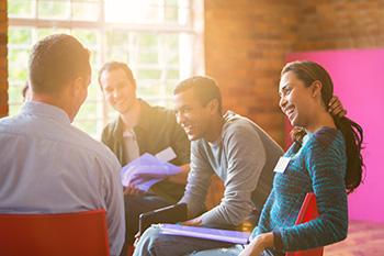 Students talking and laughing together.